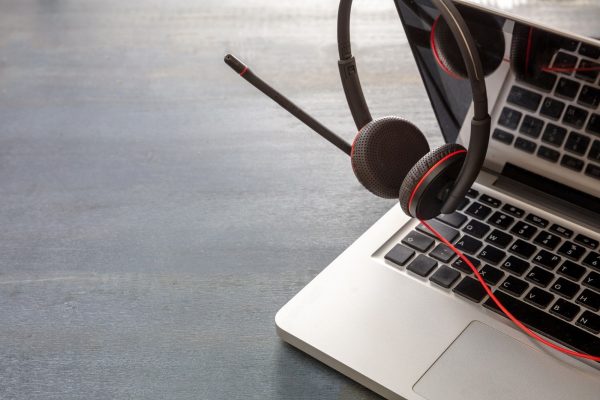 Headset on black background. Call center, home office, customer service support, help desk Headset on black background. Call center, home office, customer service support, help desk